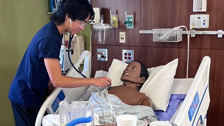 Student in a mock patient room