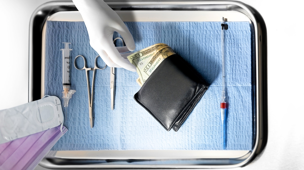 Surgeon's tray with gloved hand reaching into wallet