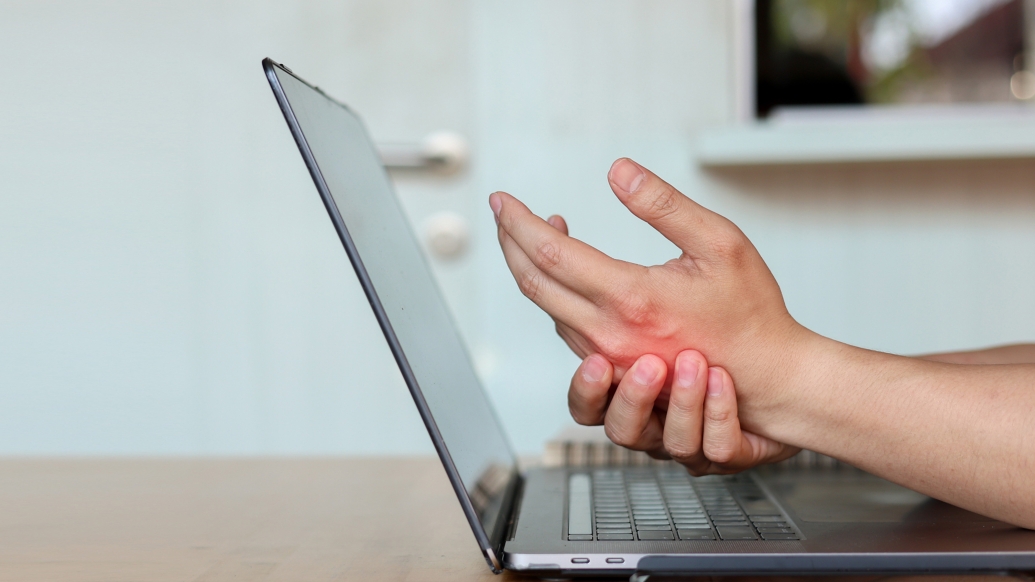 laptop and hand in pain red in hand