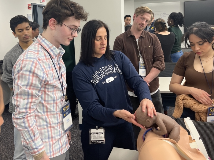 Students seeing a demonstration of child birth