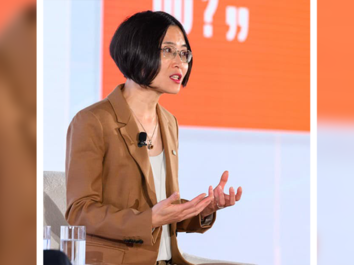 Dr. Zhen Xu pictured on stage speaking