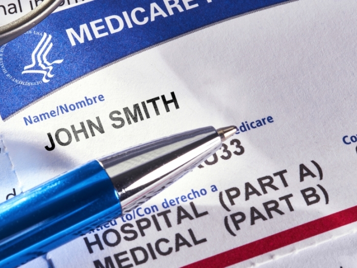 paperwork with white and blue and red and says medicare john smith hospital part a medical part b 09-01 09-0