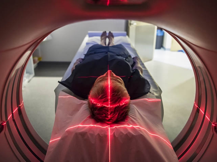 Person going into MRI looking from inside