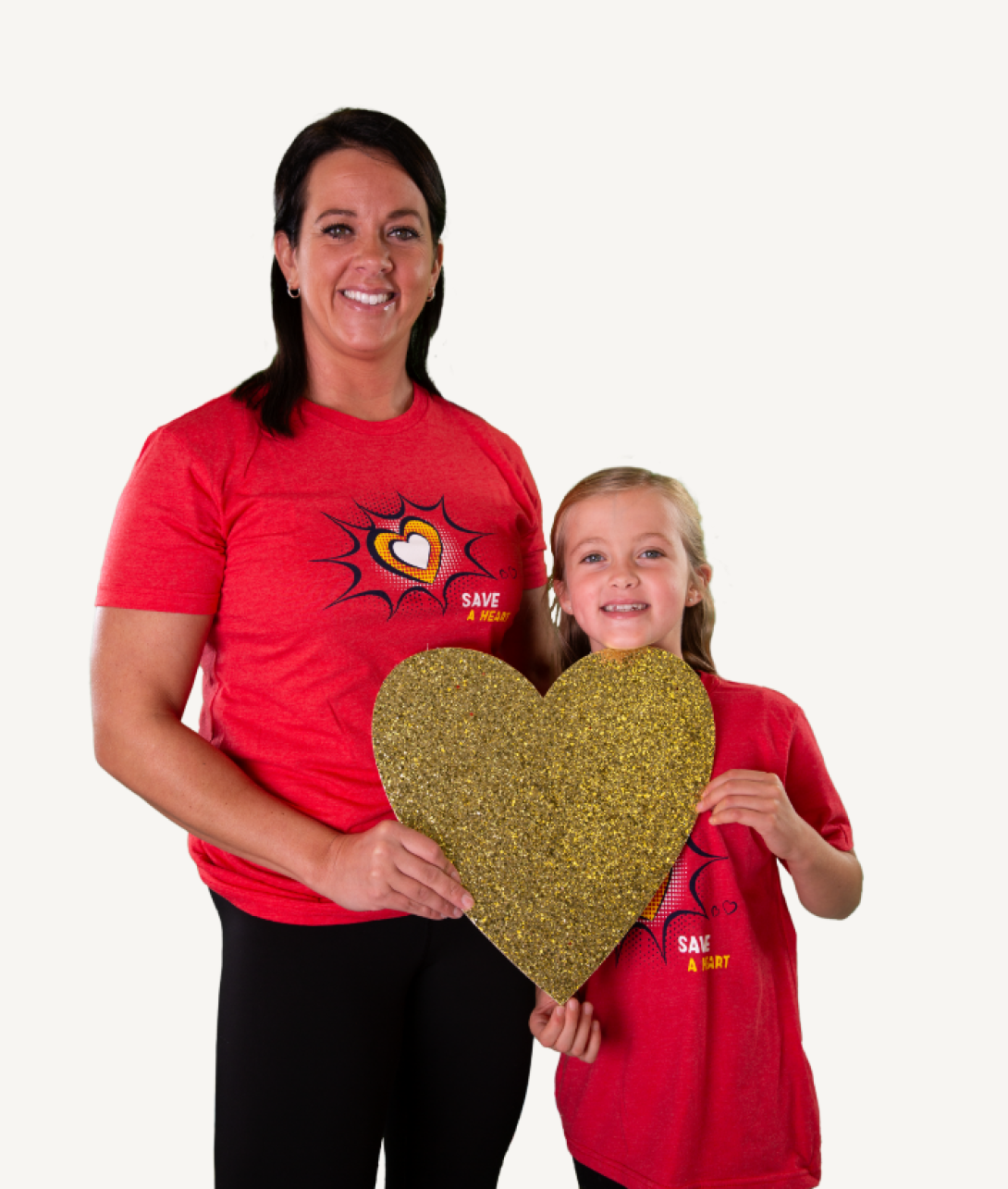 A woman with her child holding a gold glittered heart