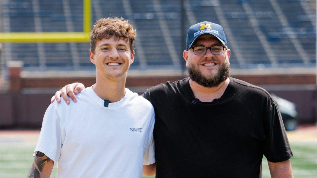 Ninja and BeardedBlevins stand on the field at Michigan Stadium.